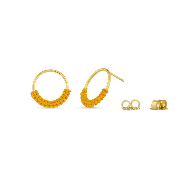 Wrapped in color with tiny silk knots, these gold-filled circle earrings are simplistic in style.