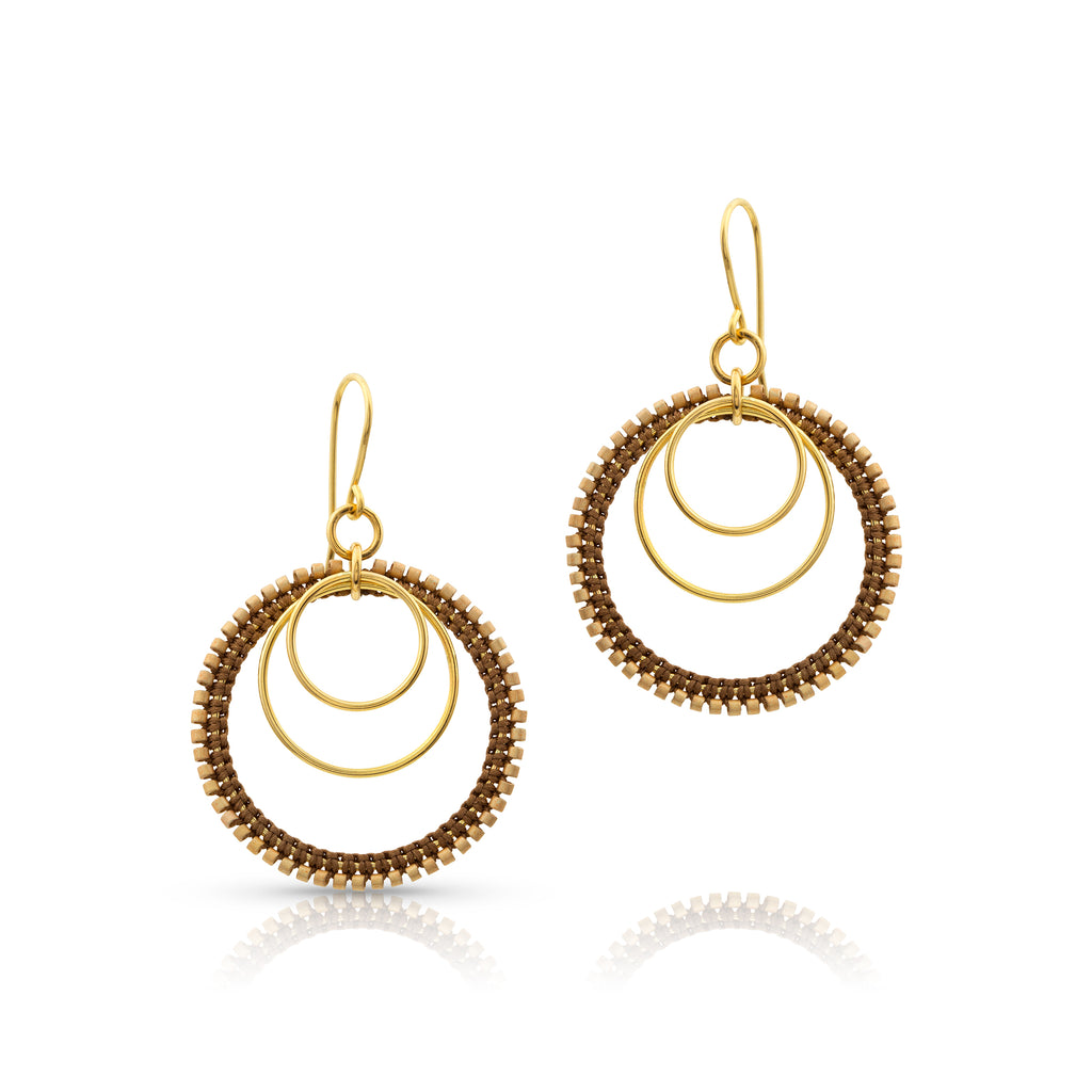 Handcrafted gold-filled hooks feature a complimentary group of beaded, silk knotted and plain gold-filled rings.