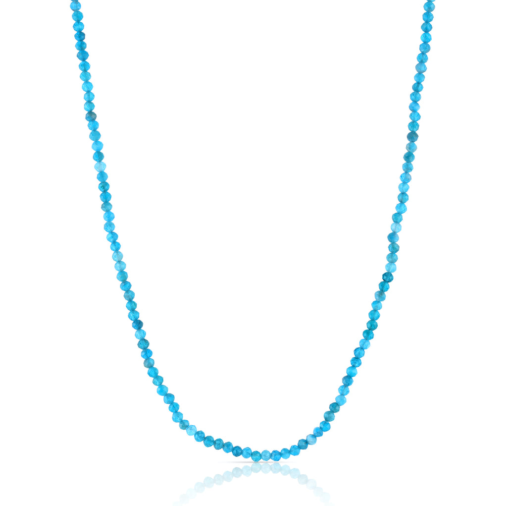 Inspired by the subtle, organic colors of an ocean shoreline, this classic beaded necklace features small, faceted apatite gemstones and a magnetic clasp.