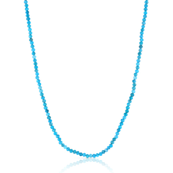 Inspired by the subtle, organic colors of an ocean shoreline, this classic beaded necklace features small, faceted apatite gemstones and a magnetic clasp.